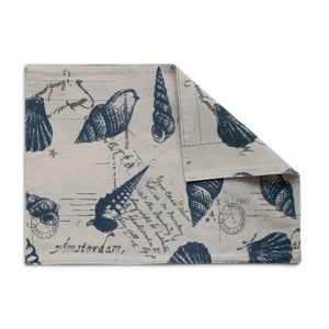 Close-up of bohemian nautical print placemat with seashell patterns and vintage stamp