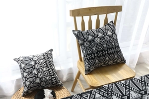 Close-up of black and white geometric pattern on bohemian style square pillowcase fabric