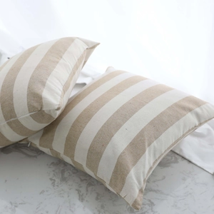 Set of two modern striped decorative pillow covers with beige linen fabric texture