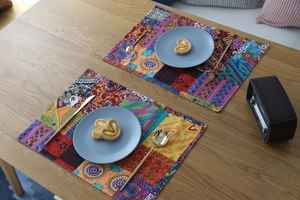 Detail of bohemian printed cotton linen placemat with colorful ethnic paisley patterns