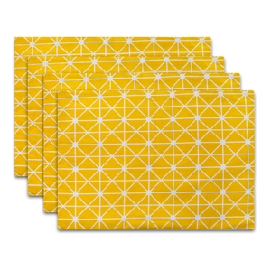 Close-up of four rectangular yellow bohemian placemats with white geometric patterns