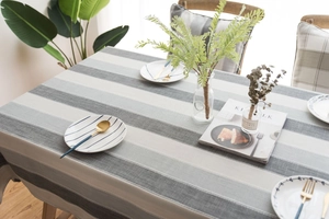 Close-up of modern striped waterproof tablecloth featuring gray and white linen texture