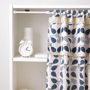 Nordic telescopic curtain rod with blue leaf print cafe curtain and lace trim details
