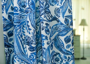 Close-up of Japanese-style linen curtain featuring elegant blue floral patterns on white fabric