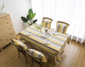 Modern yellow and grey striped waterproof tablecloth set with matching chair cushions