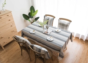 Detailed view of Nordic striped waterproof tablecloth and matching cushioned chair set