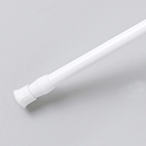 White adjustable telescopic tension rod for curtains with non-slip base in close-up view