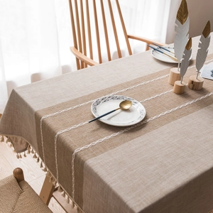 Beige faux linen rectangular tablecloth with tassels and brown wave embroidery detail