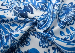 Close-up of Japanese style fabric curtain with blue and white floral twill texture