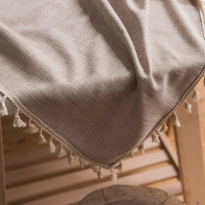 Linen texture beige tablecloth with decorative tassel edge for rectangular dining tables