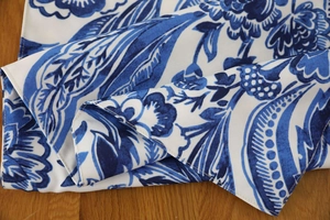 Close-up of blue floral paisley pattern on thick cotton linen table runner texture