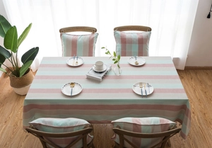 Detail view of striped waterproof table cloth set with matching chair cushions