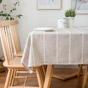 Minimalist linen rectangle tablecloth with white leaf embroidery and natural drape