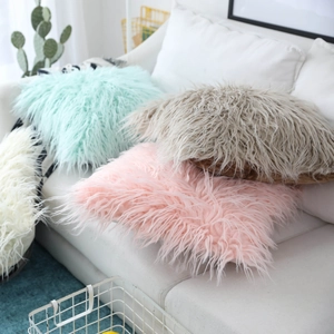 Faux sheepskin plush throw pillow covers in blue, pink, and white for sofa decor