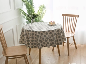 Detailed view of round cotton linen tablecloth with black tree print in Nordic style