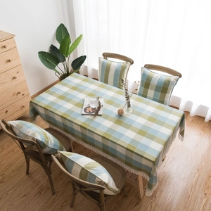 Green and blue plaid tablecloth with white floral lace trim for home decor