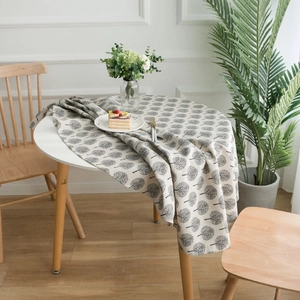 Nordic cotton linen round tablecloth with small tree pattern on light grey wood table
