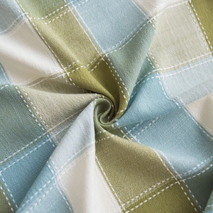 Green and light blue plaid tablecloth with decorative lace embroidery for girls' room