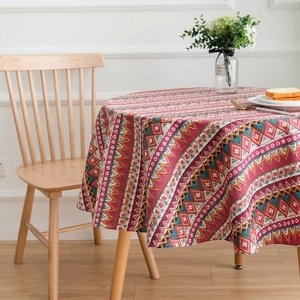 Detailed view of bohemian cotton linen round tablecloth with colorful geometric patterns