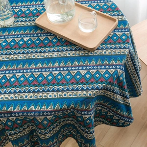 Detailed macro view of Bohemian blue geometric linen tablecloth with drape texture