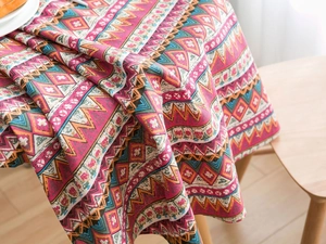 Close-up of bohemian geometric print tablecloth with colorful zigzag and floral patterns