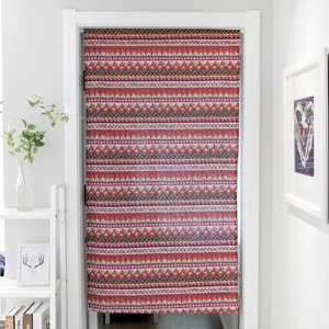 Close-up of Bohemian door curtain with red and blue geometric diamond patterns