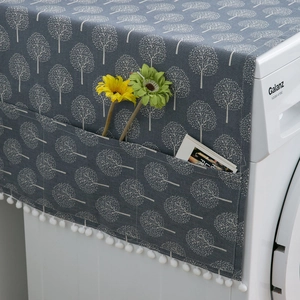 Dark grey dust cover for washing machines with white tree pattern and side storage pockets