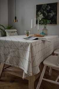 Macro detail of rectangle cotton linen tablecloth with black geometric triangle pattern
