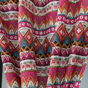Detailed macro shot of bohemian geometric printed fabric with thick woven texture