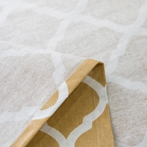 Macro shot of geometric clover pattern fabric showing high-quality stitching and texture