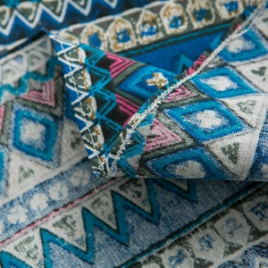 Bohemian blue geometric linen tablecloth featuring ethnic patterns and high-quality edge stitching