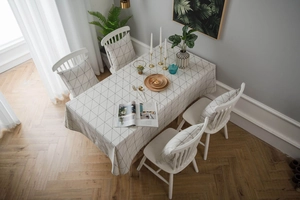 Detail of minimalist black and white geometric grid pattern on cotton linen tablecloth