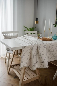 Close-up of minimalist black and white geometric pattern on linen cotton tablecloth