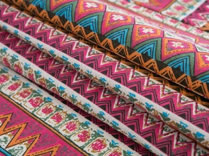 Close-up of bohemian geometric patterns and thick cotton-linen fabric texture
