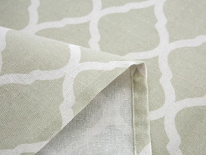 Detail of sage green geometric fridge cover showing high-quality stitching and fabric texture