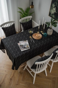 Close-up of modern black and white geometric pattern linen tablecloth with triangle textures