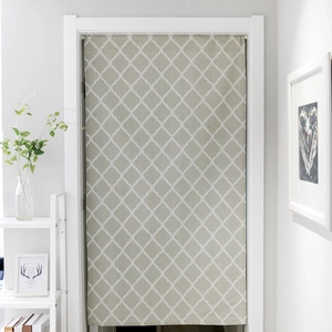 Close-up of light green geometric quatrefoil pattern on cotton linen door curtain fabric