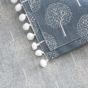 Blue linen refrigerator dust cover with white tree prints and pom-pom lace trim