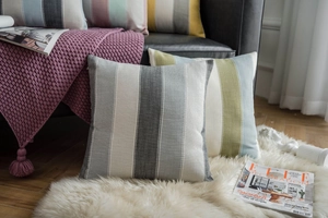 Close-up of modern striped cotton linen pillowcase with high-quality woven textile texture