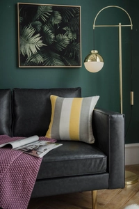Detailed texture of modern yellow and gray striped sofa cushion in a cozy room setting