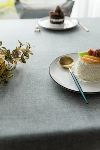 Detail of light blue tablecloth with fine woven texture and cotton linen fabric material
