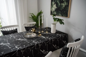 Close-up of black marble print tablecloth with matching chair cushion set in Nordic style