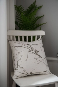 Close-up of white marble pattern on cotton linen tablecloth featuring high texture detail