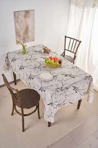 Detailed top view of white marble pattern tablecloth in a modern Nordic dining setting