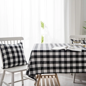 Classic black and white buffalo plaid tablecloth and matching cushions for dining table