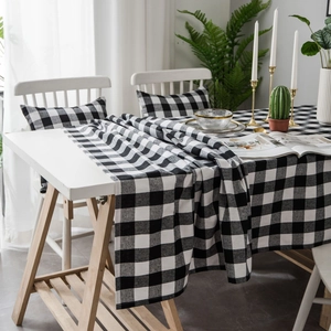 Classic black and white buffalo plaid tablecloth set with matching pillows and table runner