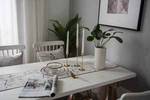 Modern minimalist marble pattern table runner with golden candle holders and home decor