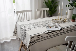 Detail view of Bohemian cotton linen tablecloth with black geometric ethnic patterns