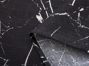 Detail of black marble print door curtain showing high-quality stitching and fabric texture
