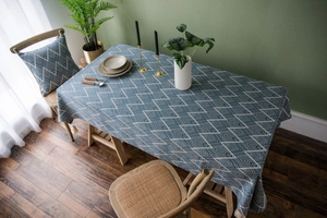 Navy blue jacquard tablecloth with geometric patterns and elegant decorative tassels